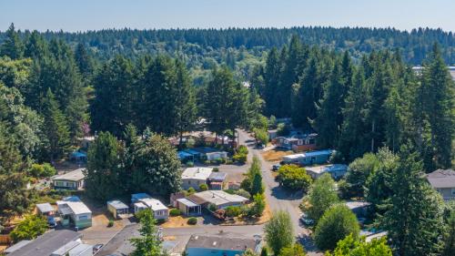 Aerial view of a rv park in a forest.